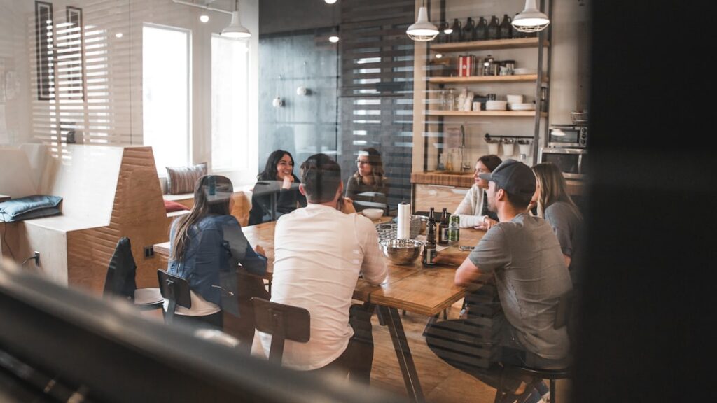 Group of colleagues meeting around a long table