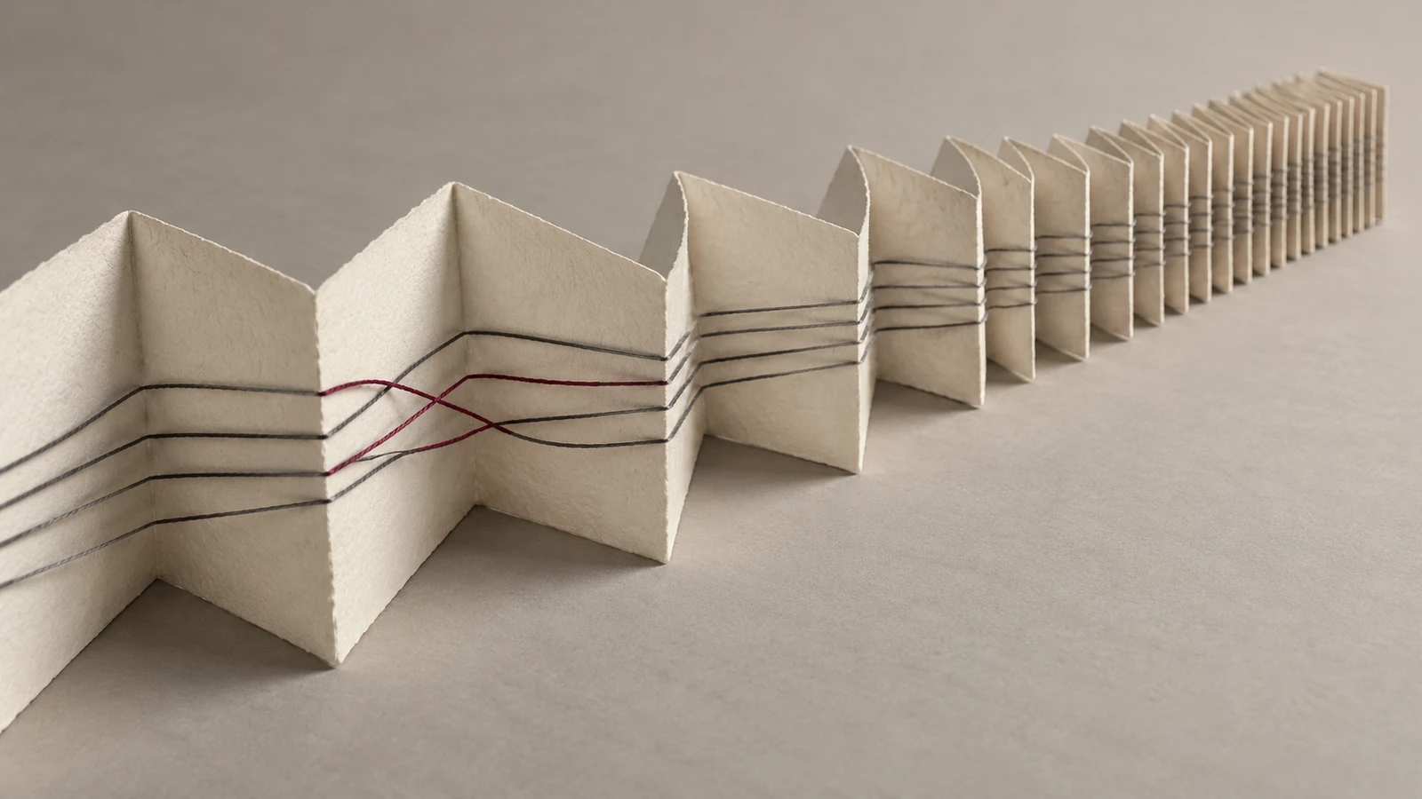 Lines cross folded paper that becomes tightly compressed, illustrating the narrowing window for a security transition.